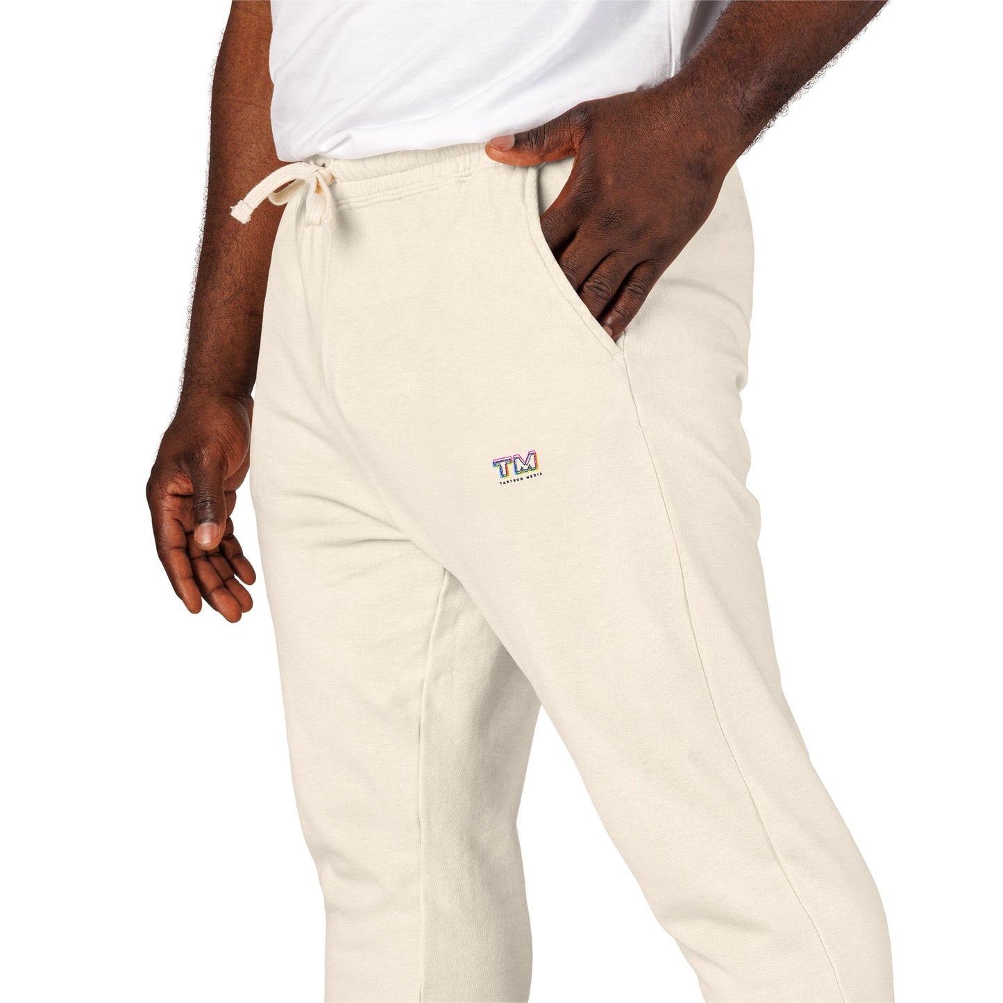 Beige sweatpants with Tantrum Media logo on a white background