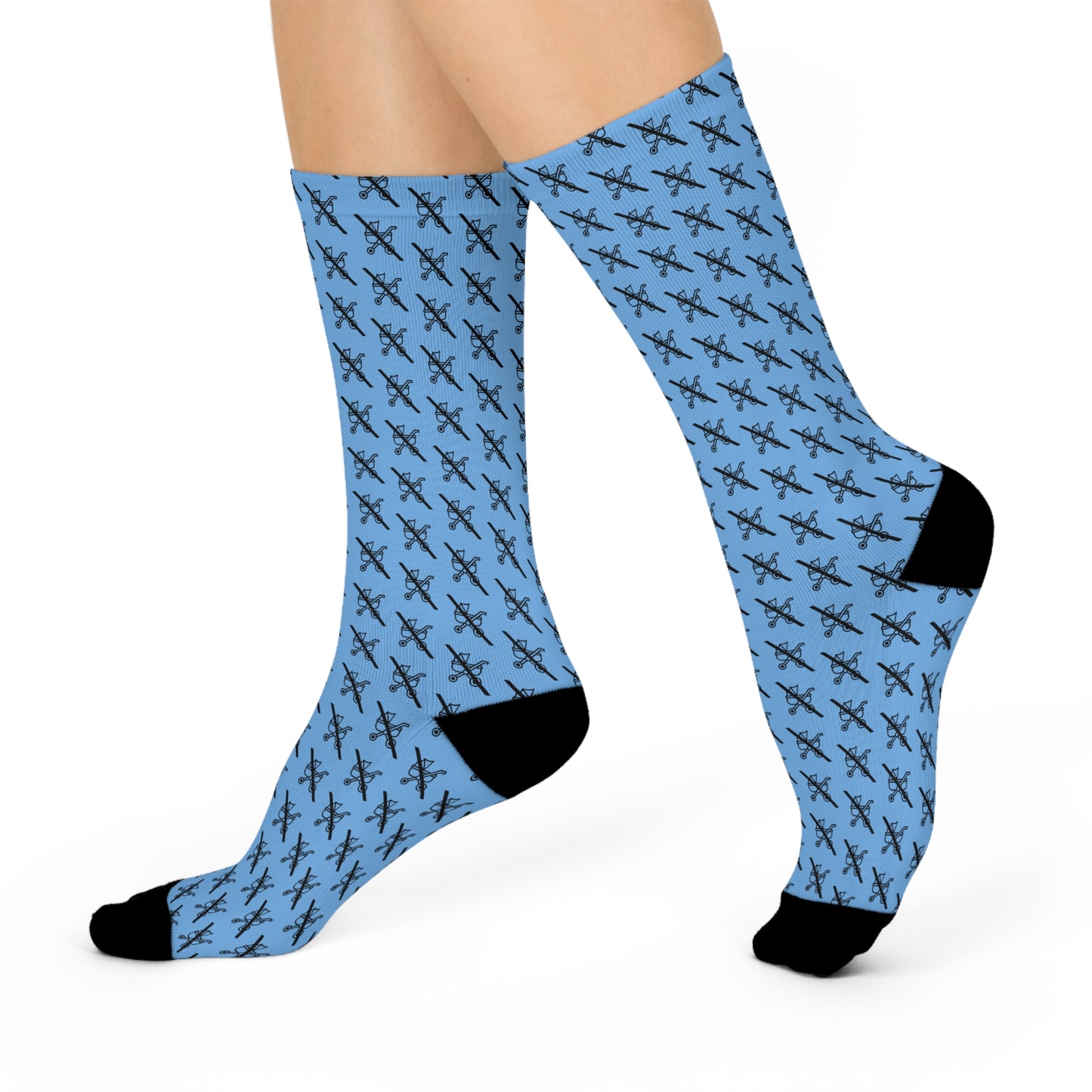 Blue Proudly Childless crew socks with black heel and toe worn in side profile view