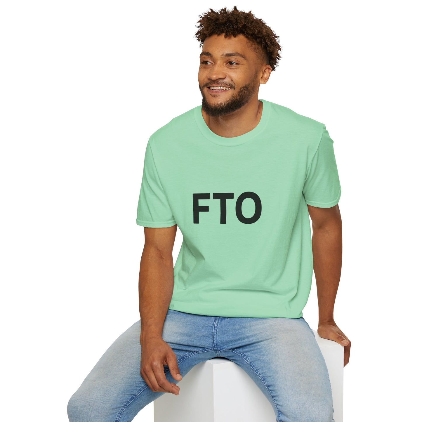 Man wearing a light green t-shirt with 'FTO' text on a white background