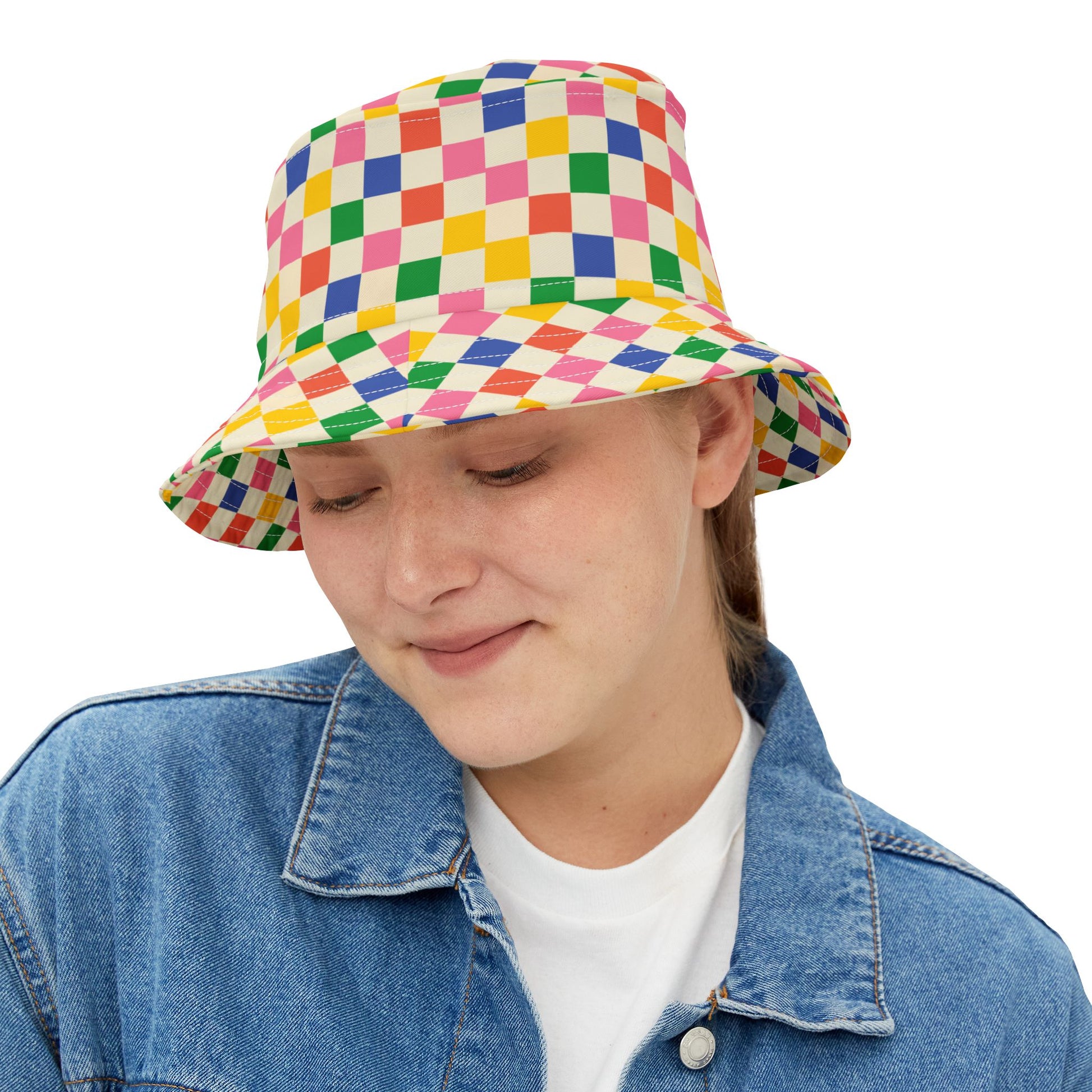Woman wearing Colored Squares Bucket Hat, smiling slightly.
