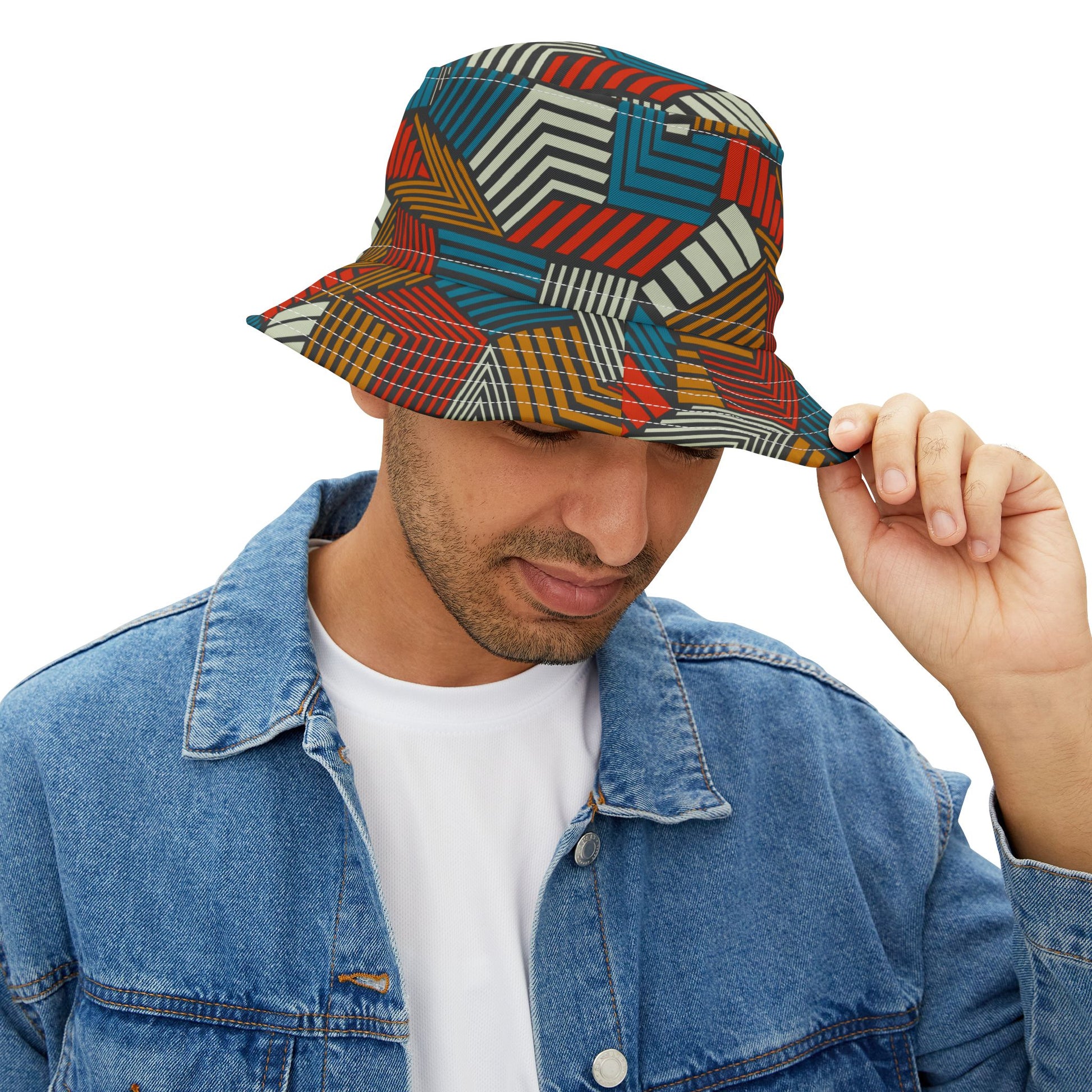 Man wearing Urban Safari Bucket Hat, looking down while holding brim.