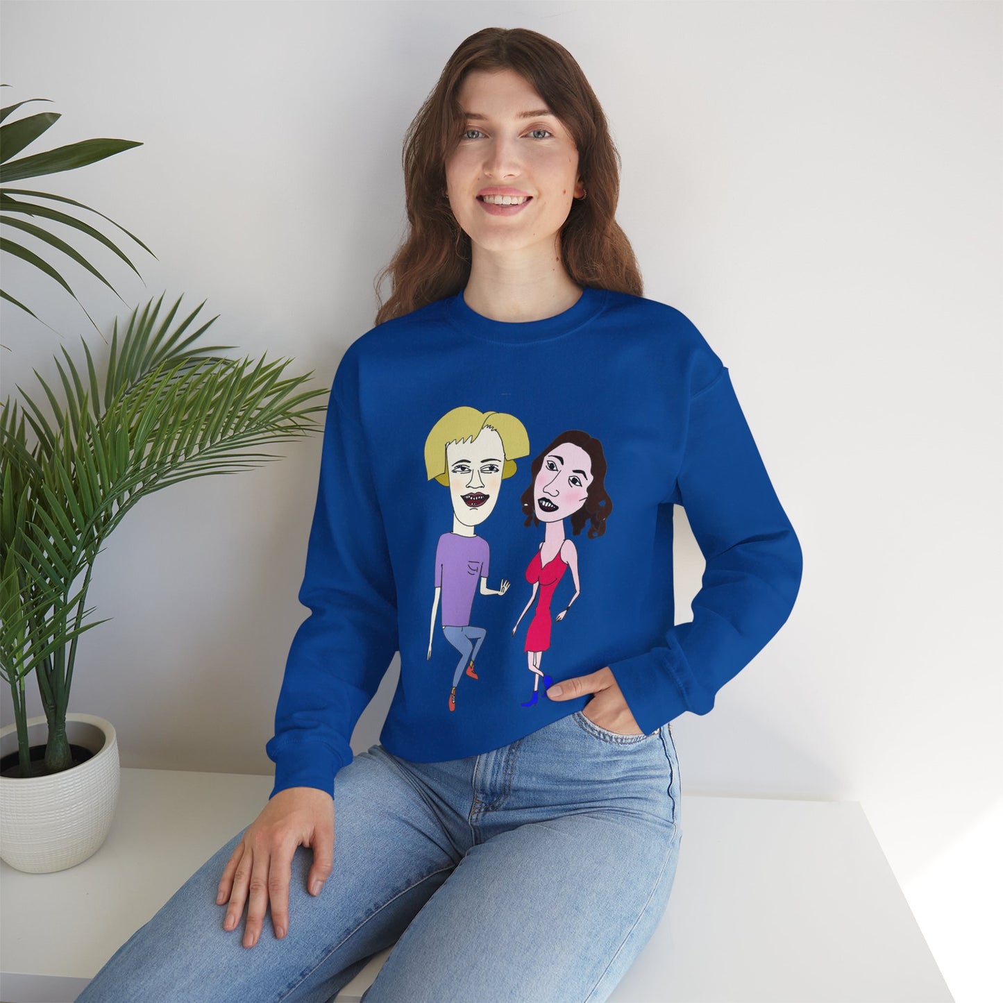 Model sitting in blue Lily and Matthew couple sweatshirt.