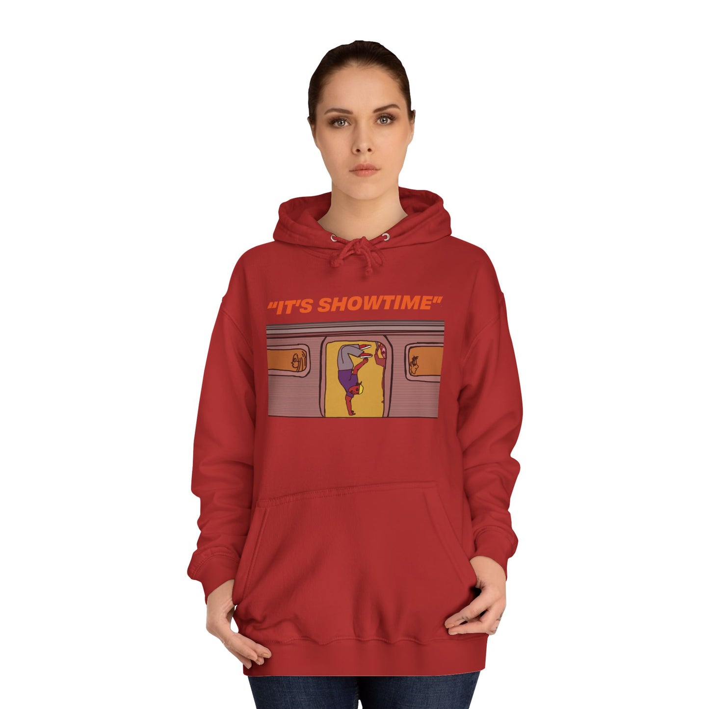 Female model wearing red It’s Showtime Hoodie with subway performer artwork on front.