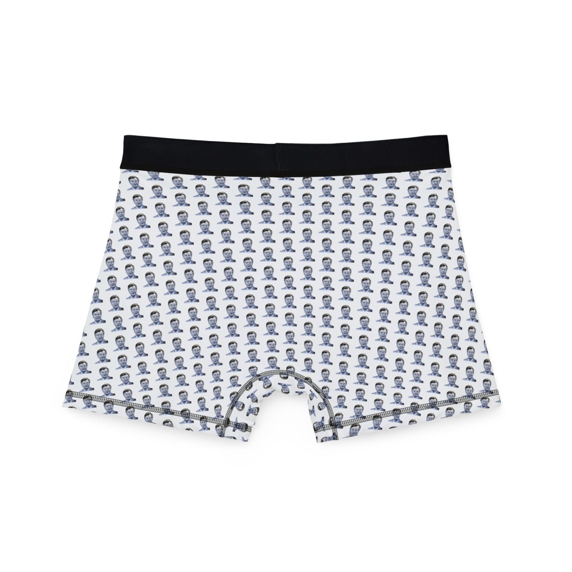 Flat lay front view of Benny Hill Men’s Boxers with black waistband and comedic design