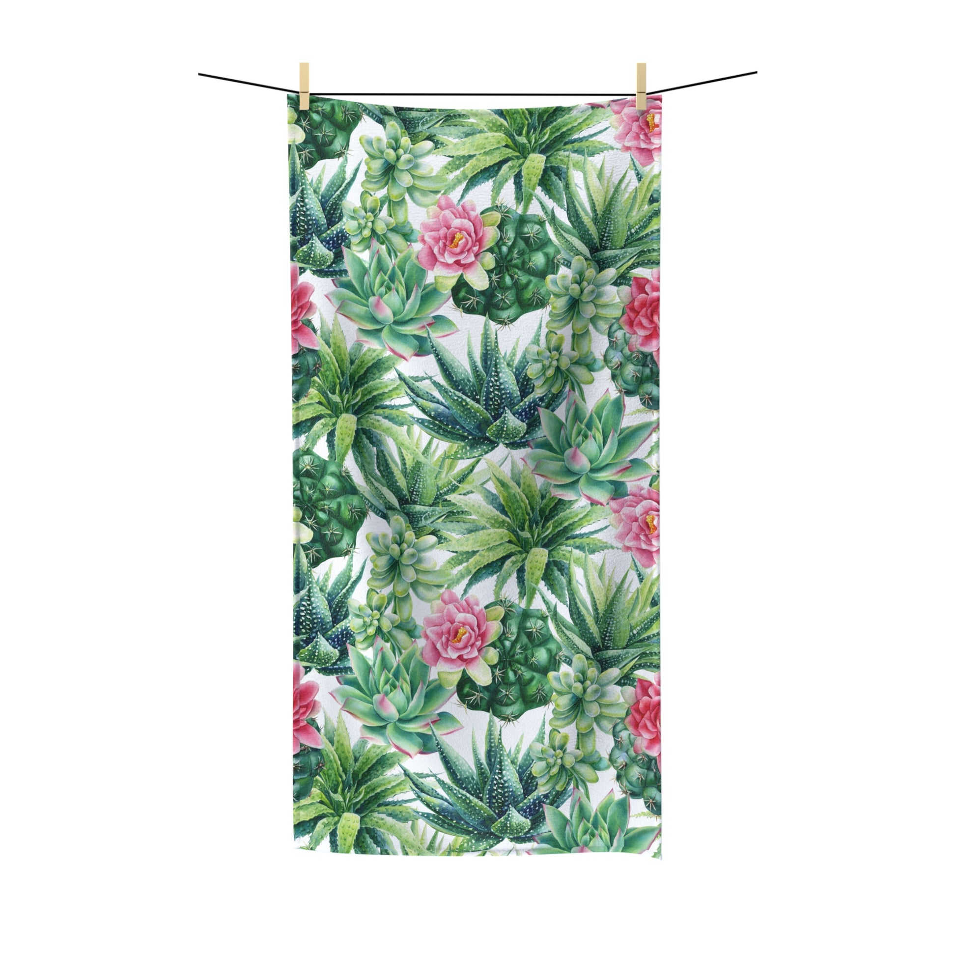 Succulent Flowers Beach Towel with vibrant green succulents and pink floral print, hanging on a line