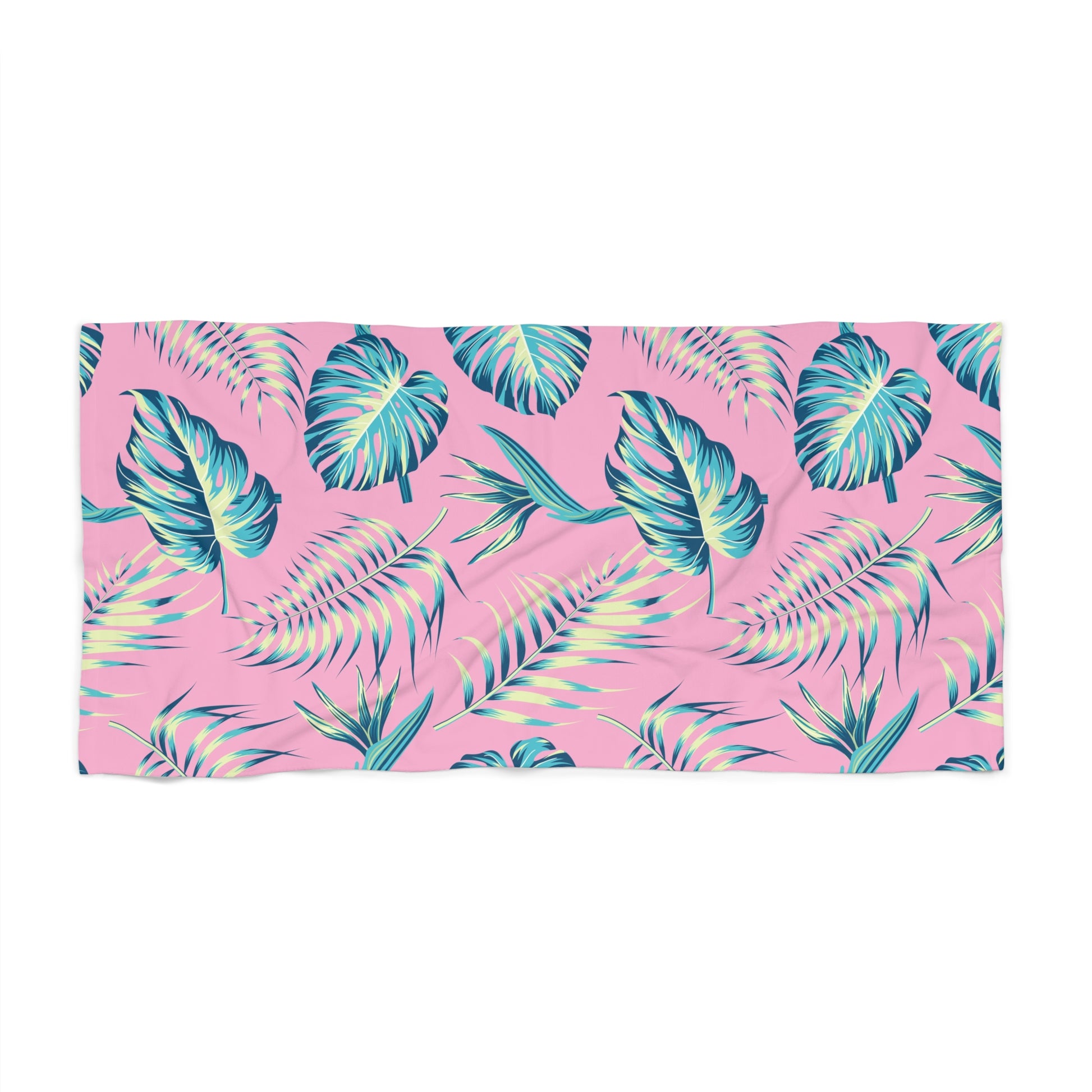Towel with tropical leaf pattern on a pink background