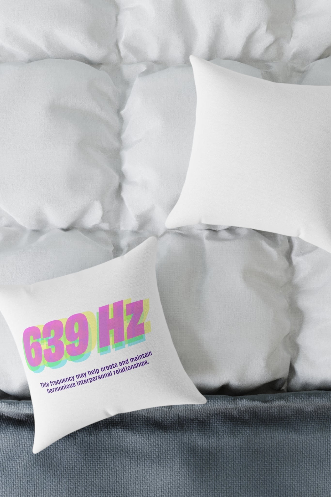 639 Hz polyester pillow displayed on a bed with cozy white bedding