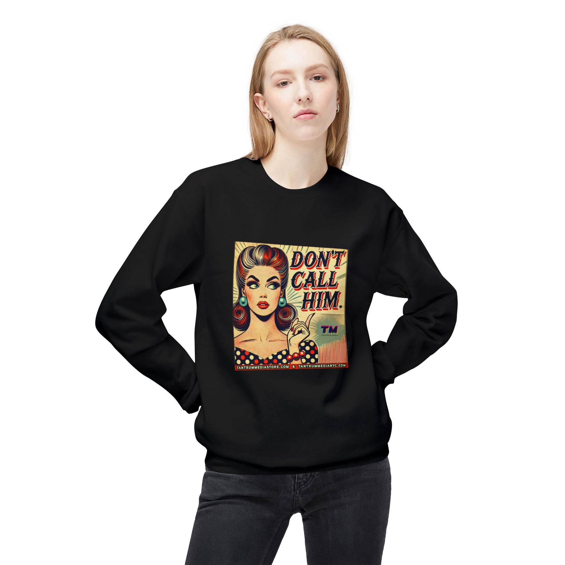 Woman wearing a black sweatshirt with a vintage pop art graphic of a red-haired woman holding up one finger and the bold text “DON’T CALL HIM!” in comic-style font.