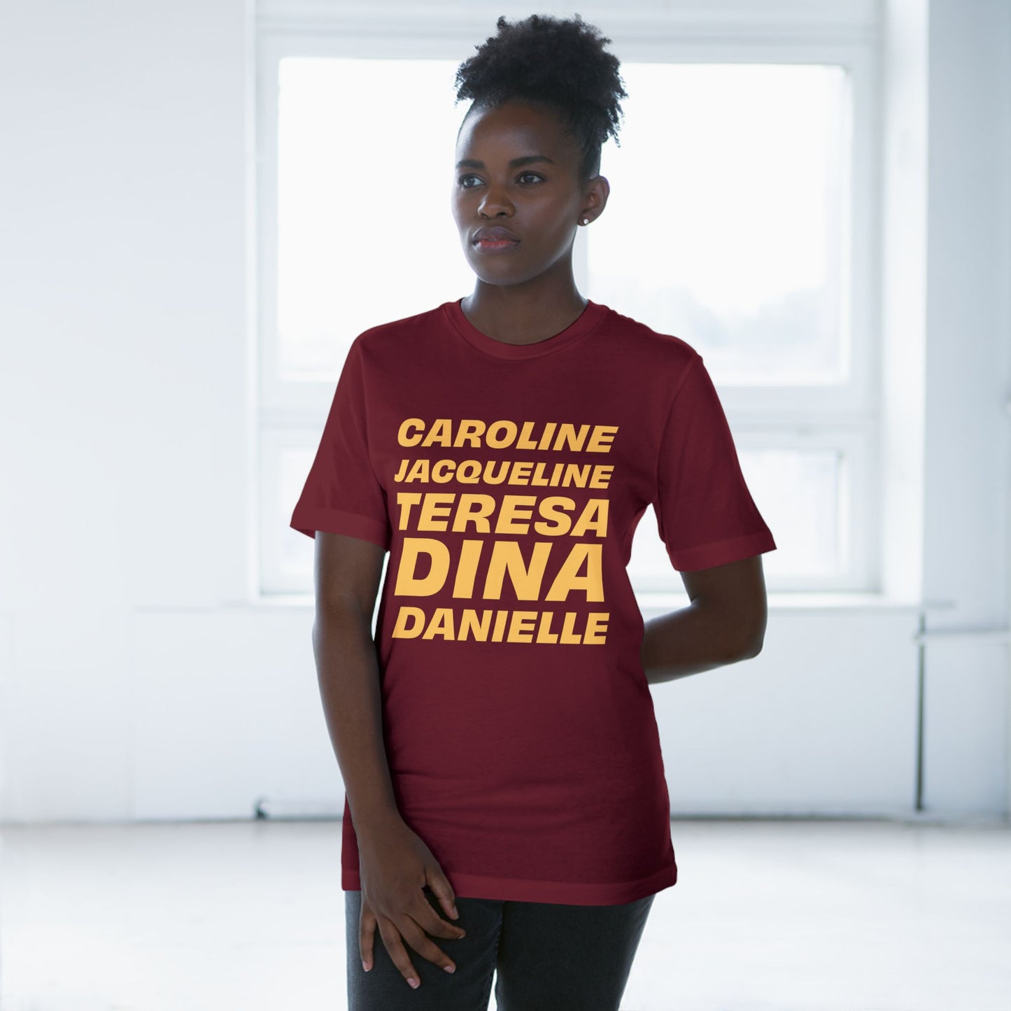 Female model wearing burgundy OG NJ Housewives graphic t-shirt lifestyle shot