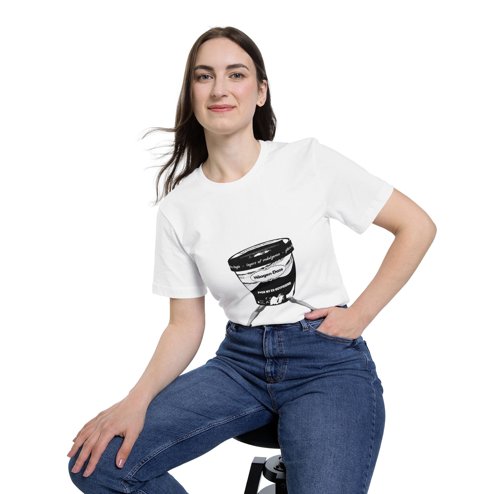 Woman sitting in white jersey t-shirt with bold ice cream tub graphic and hand in pocket