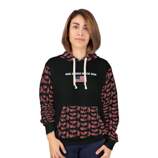 A person wearing a black unisex hoodie with the phrase "Make America Healthy Again" above an American flag graphic, featuring red floral patterned sleeves and front pocket, standing against a white background.