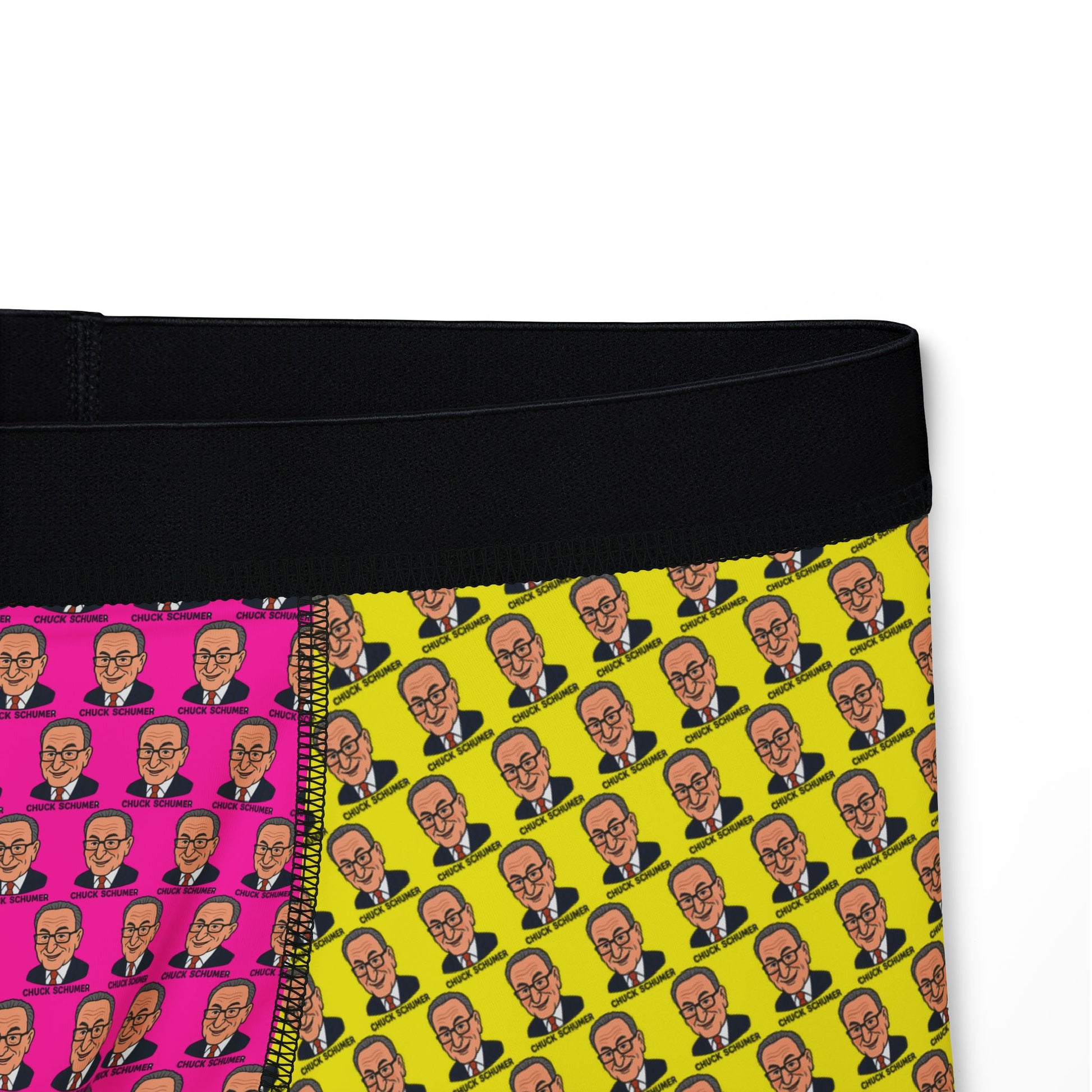 Close-up of waistband and graphic panel showing Chuck Schumer face print on yellow and pink background