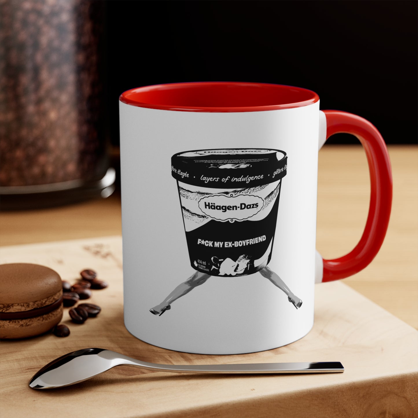 White mug with red interior featuring funny breakup design on table