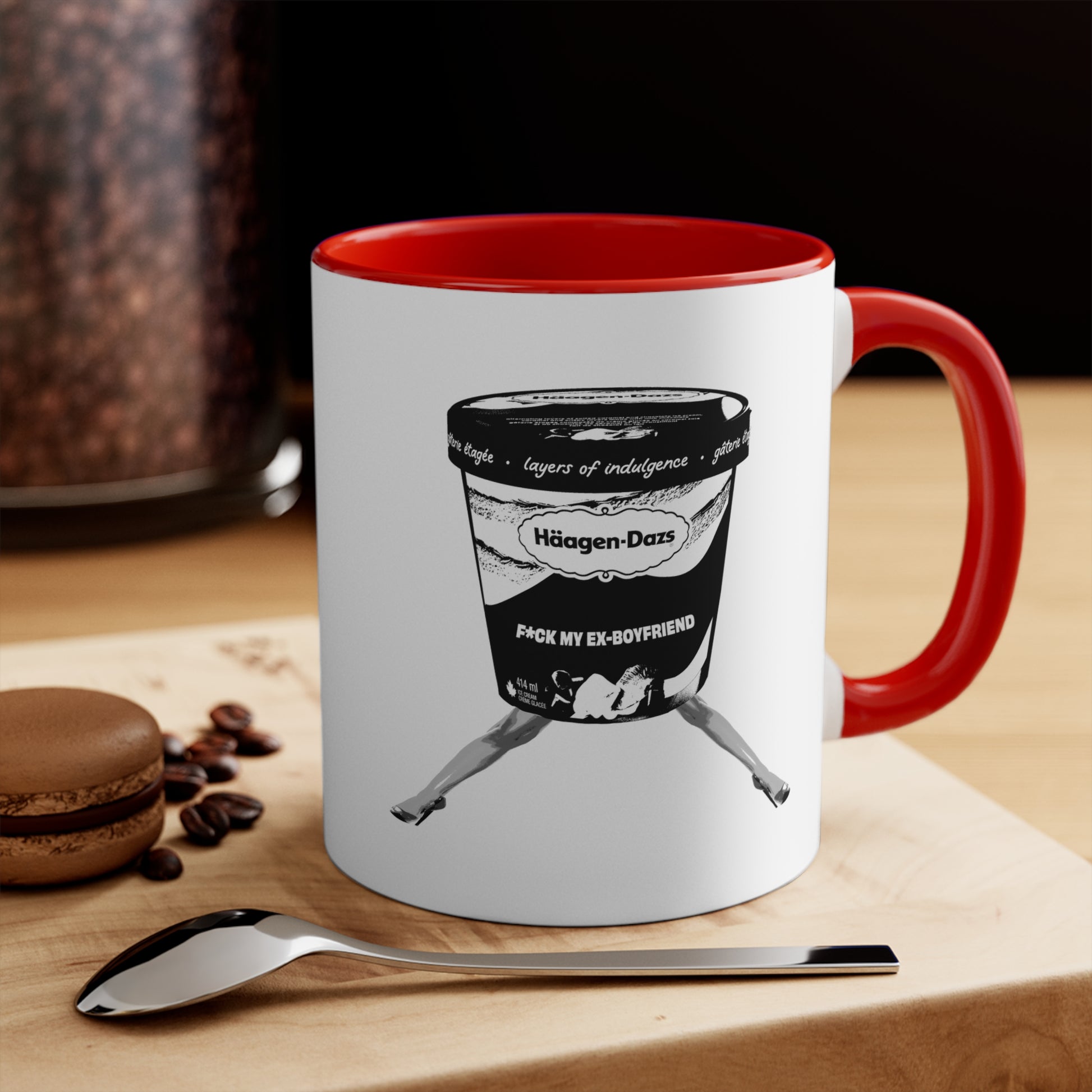 White mug with red interior featuring funny breakup design on table