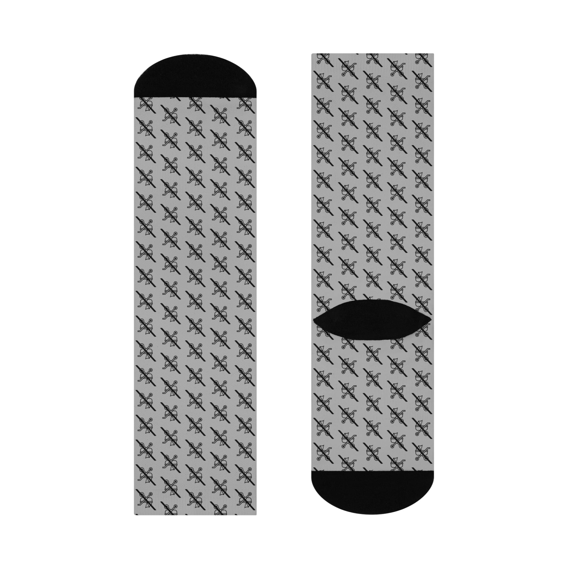 Flat lay of single grey Proudly Childless crew sock front and back with black accents