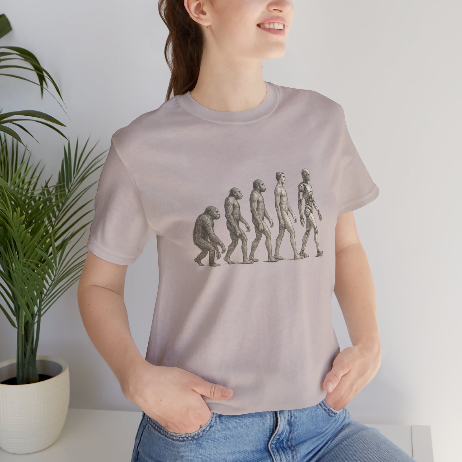 Person wearing a t-shirt with a graphic design of human evolution on a plain background