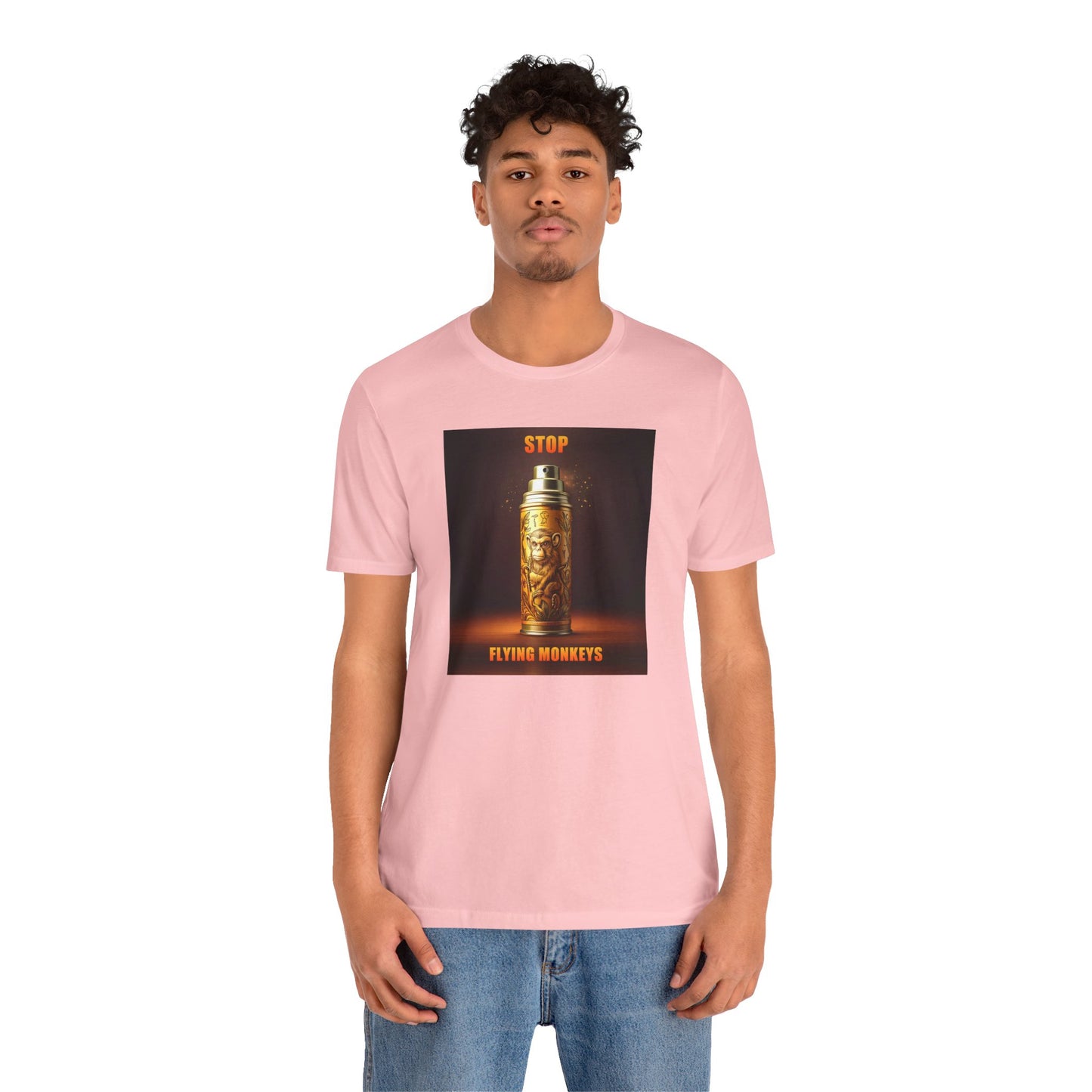 Man in pink Stop Flying Monkeys T-Shirt standing casually