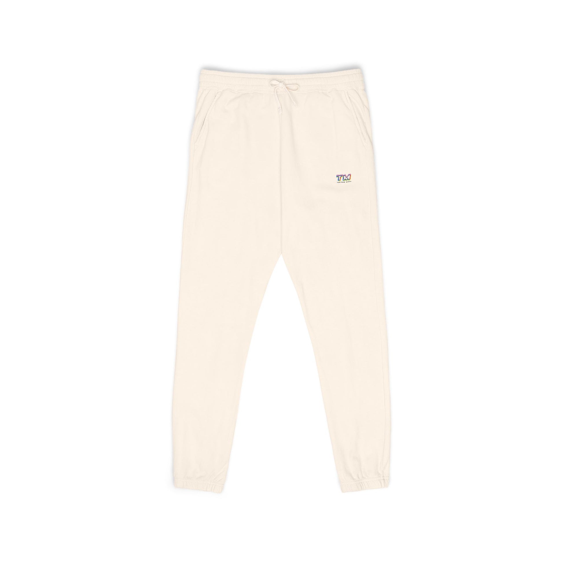 Cream Tantrum Media Cozy Fleece Sweatpants flat lay with embroidered TM logo
