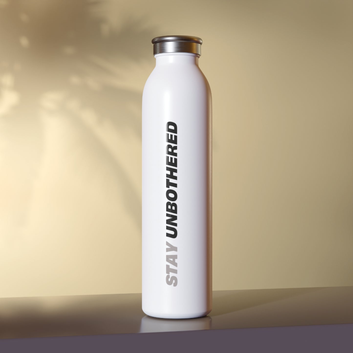 Stay Unbothered bottle lifestyle studio lighting shot