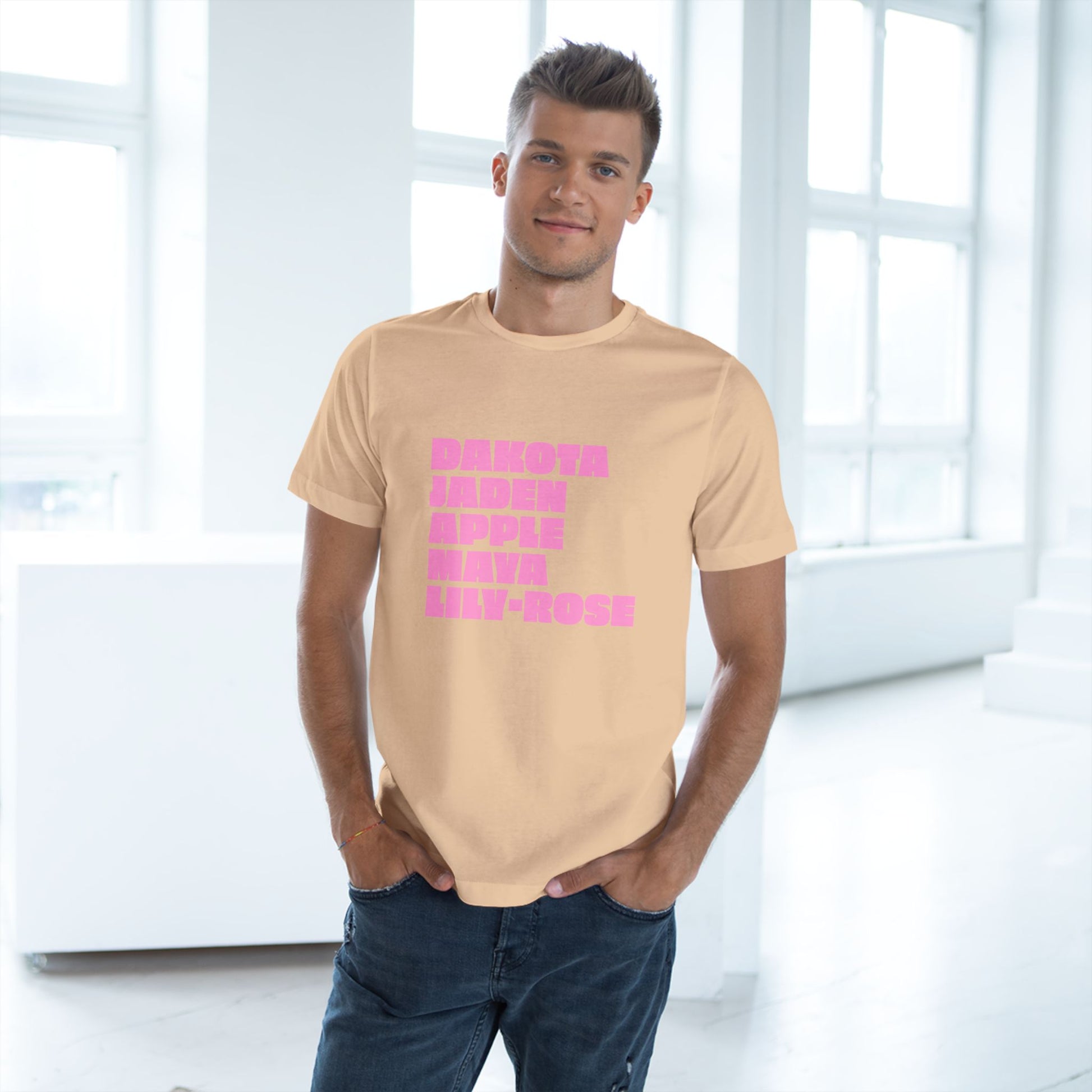Beige Nepo Babies List T-Shirt with pink lettering worn by male model