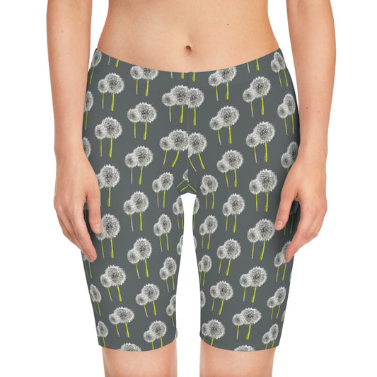 Front view of woman wearing Dandelion Women’s Bike Shorts with gray base and white dandelion print