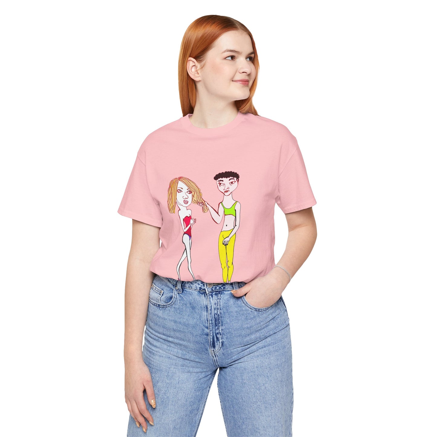 Red-haired model wearing a pink Charlotte and Van hand-drawn couple tee, one hand in pocket with relaxed pose.