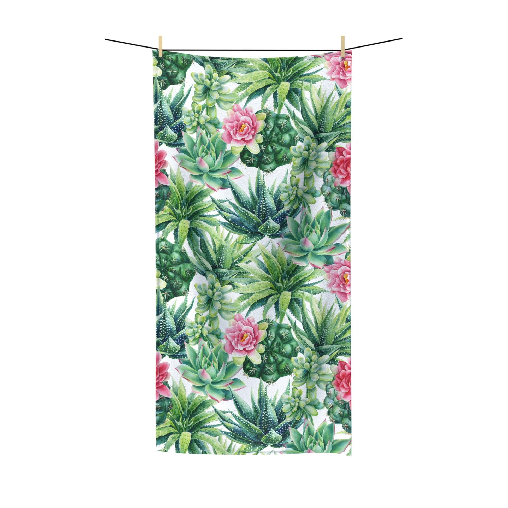 Succulent Flowers Beach Towel with vibrant green succulents and pink floral print, hanging on a line