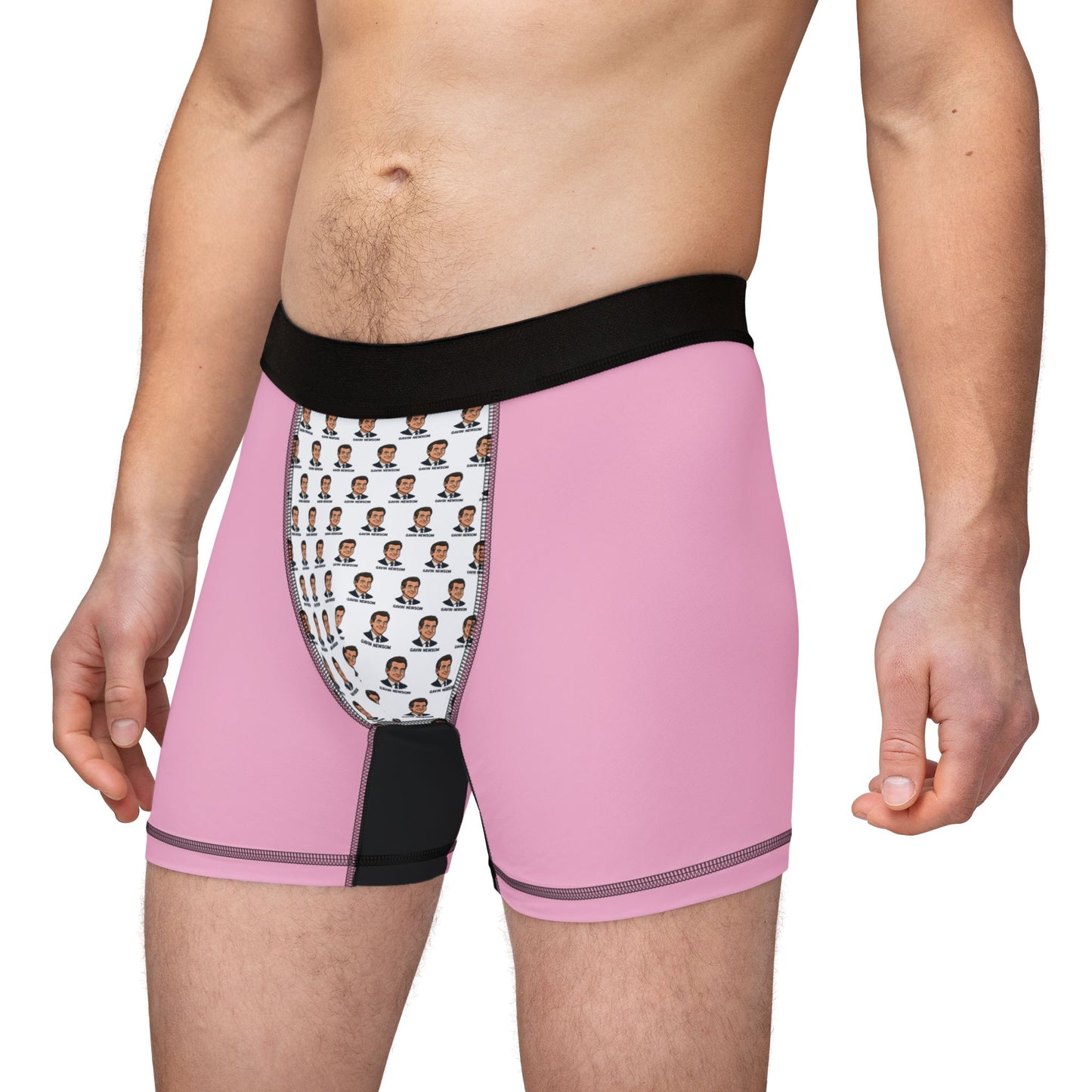 Male model wearing Gavin Newsom boxer briefs with pink sides, white face-print pouch, and black waistband.