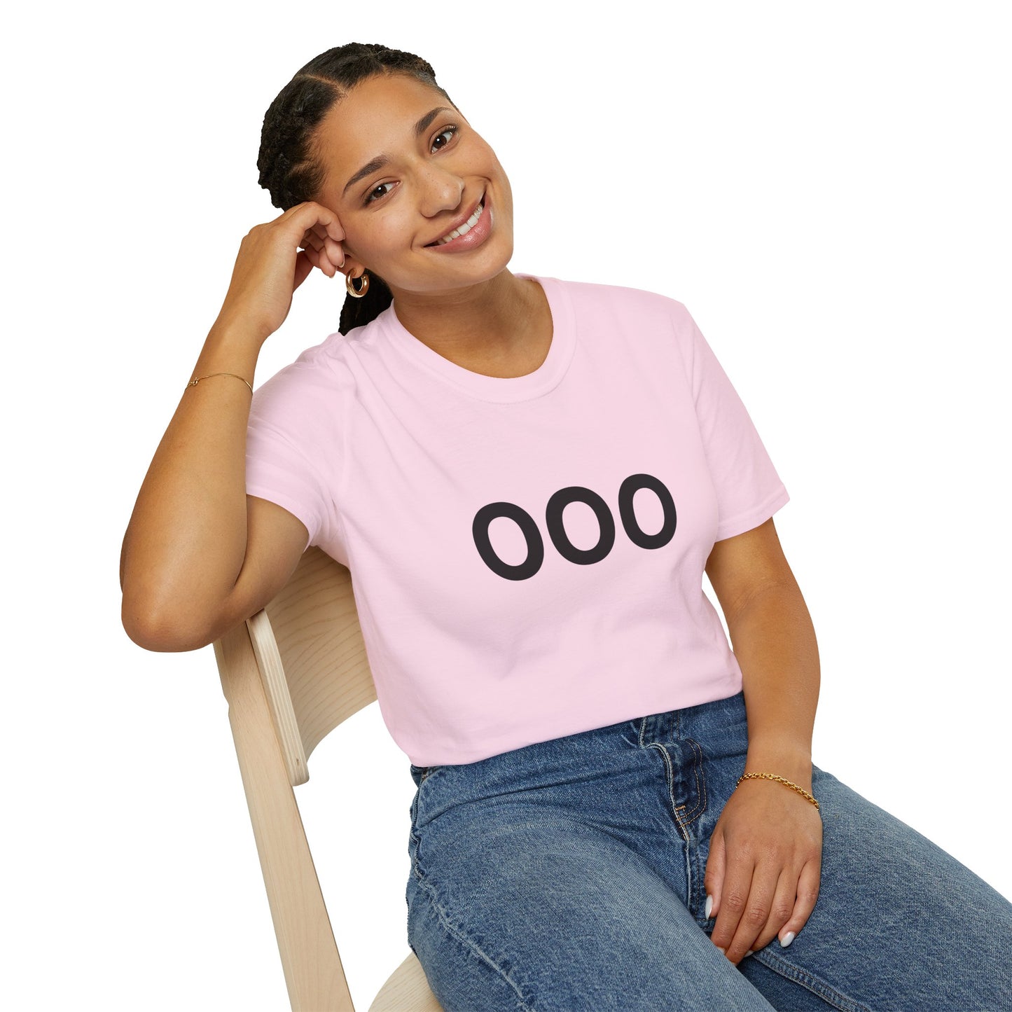 Woman in pink OOO tee leaning on chair