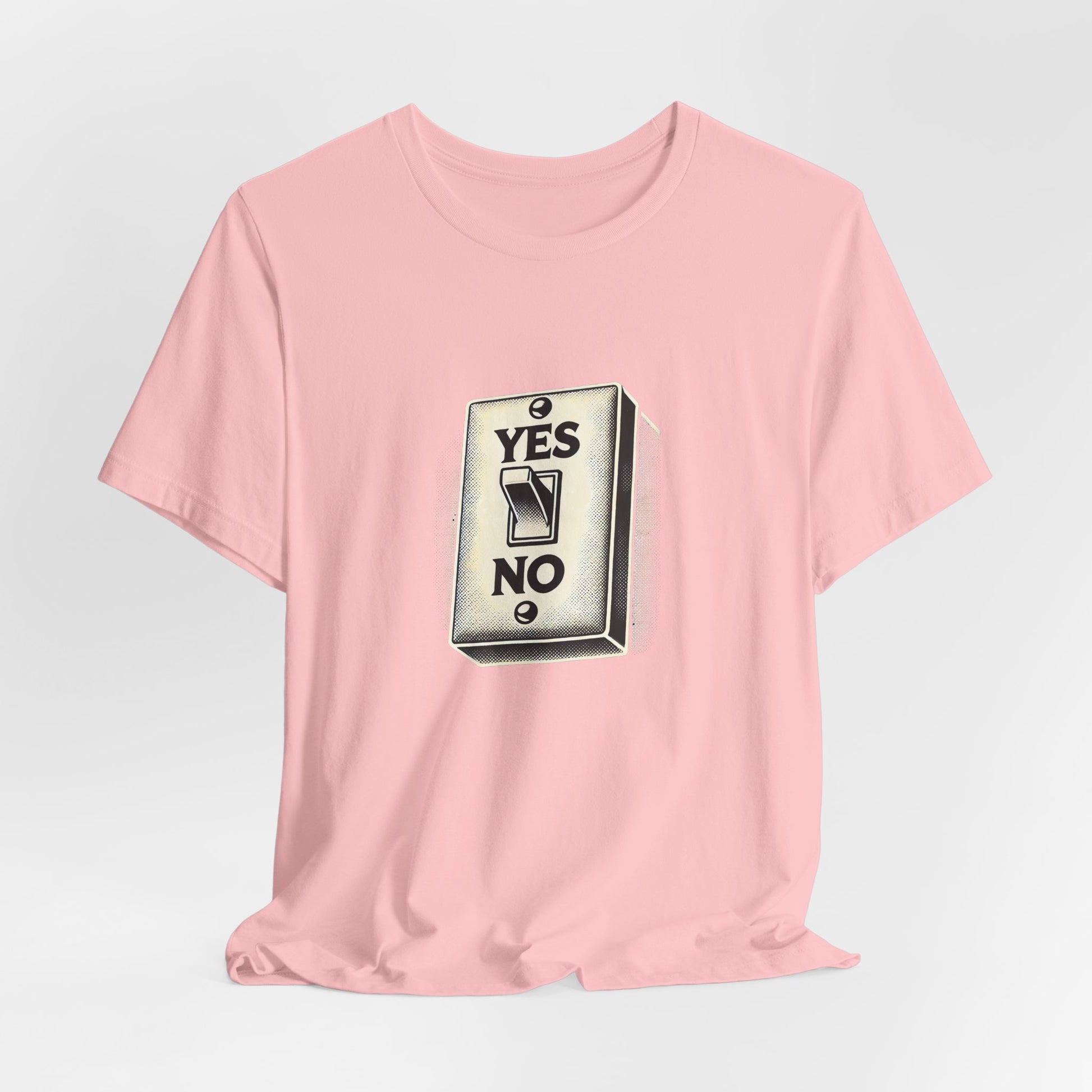 Flat lay of pink YES/NO Switch Tee with bold halftone switch design