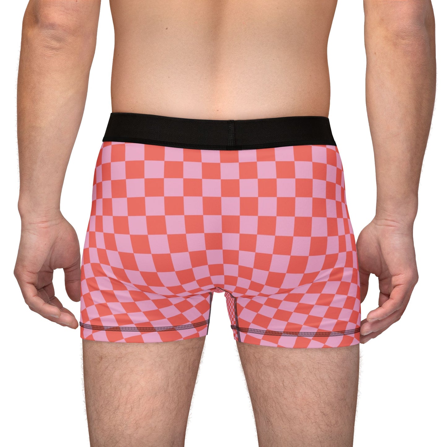 Back view of man wearing AOC checkered boxer briefs showing full rear pattern.