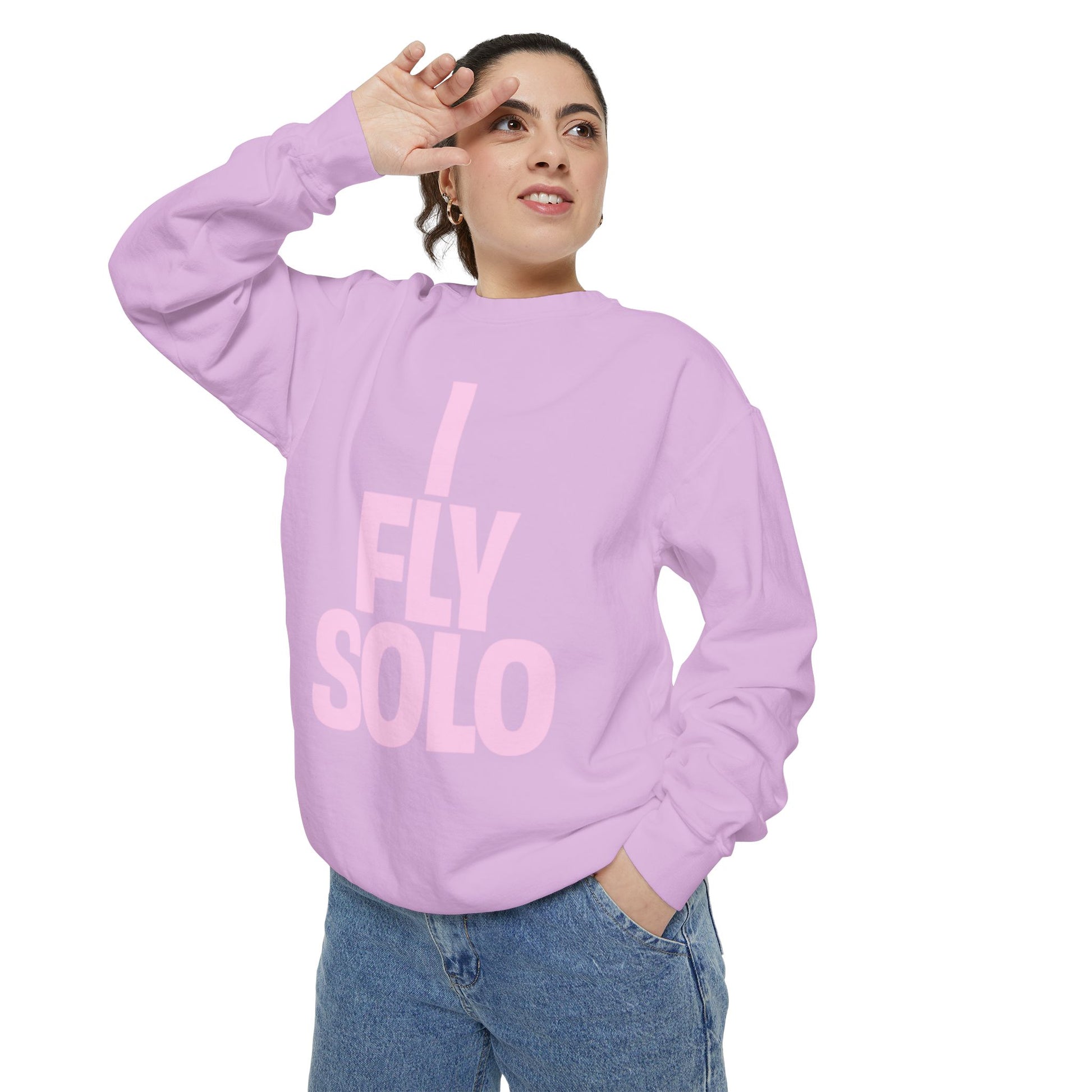 Person wearing a lavender sweatshirt with 'I Fly Solo' text on a white background