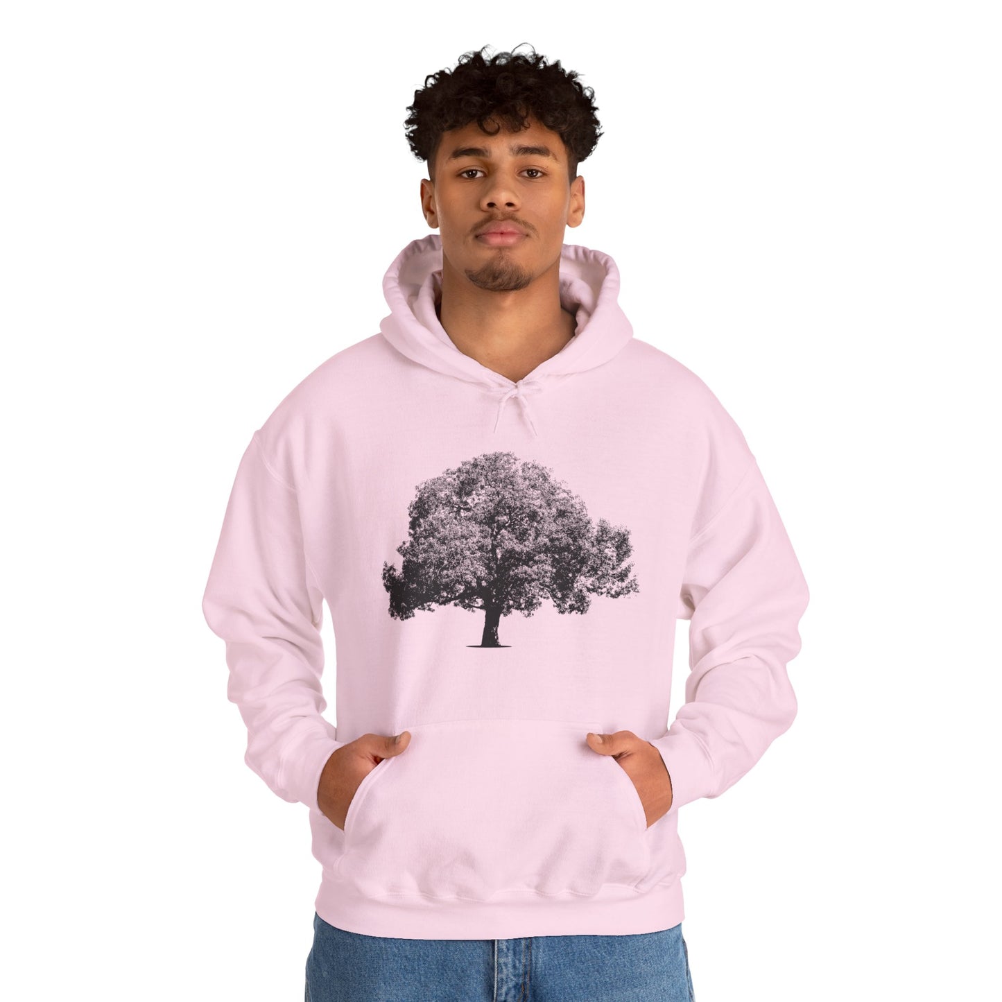 Man wearing pink Tree Hoodie with black tree graphic