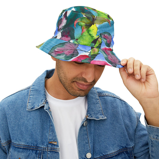 Man wearing Acquarela Bucket Hat with vibrant watercolor floral design, holding brim down.