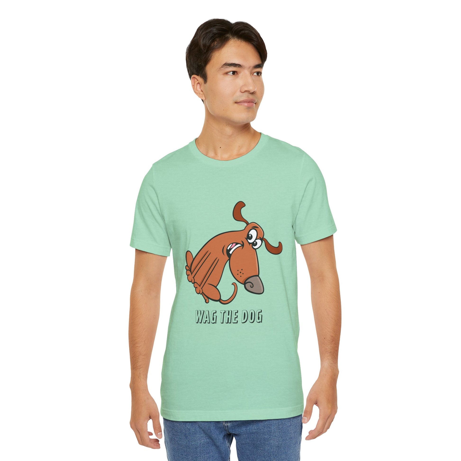 Male model wearing Wag The Dog T-Shirt in mint green with dog illustration