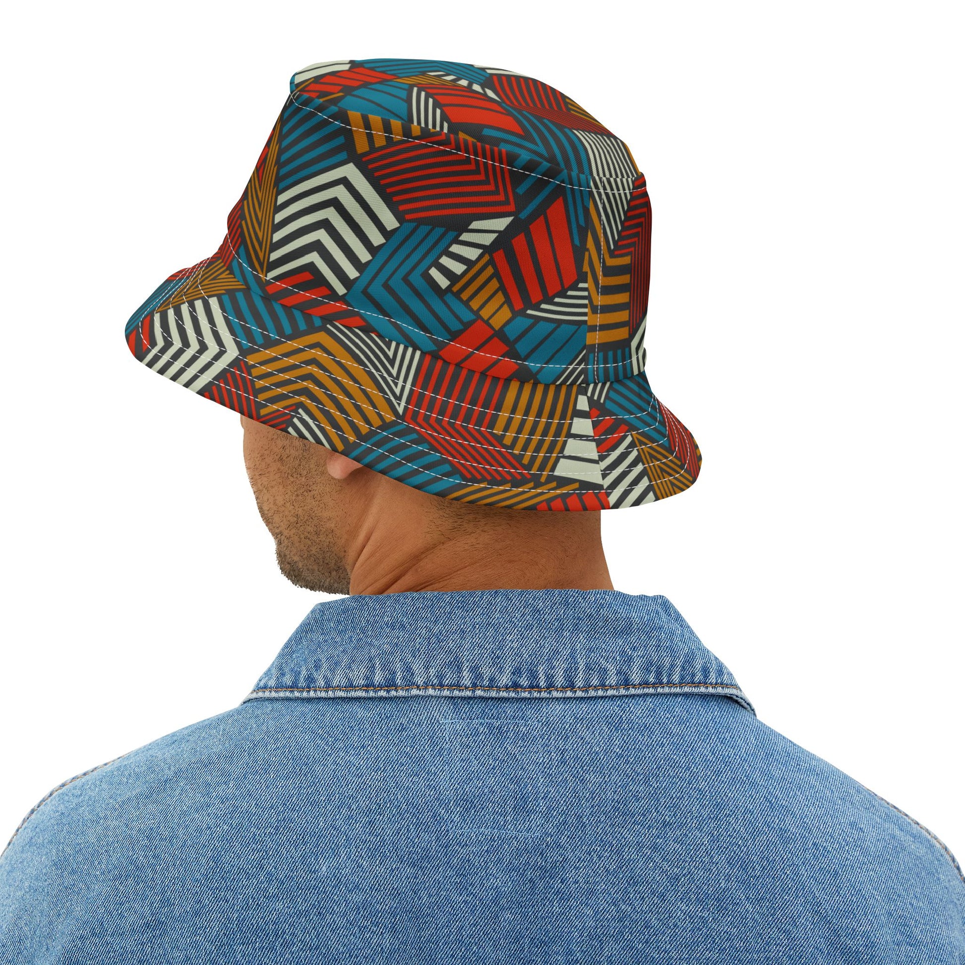 Person wearing a colorful geometric-patterned bucket hat on a white background