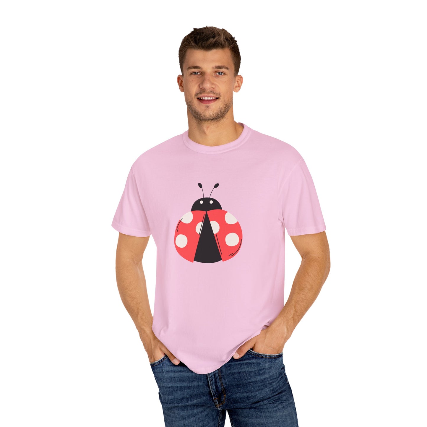 Man wearing light pink Lady Bug T-Shirt with lady bug design, smiling.