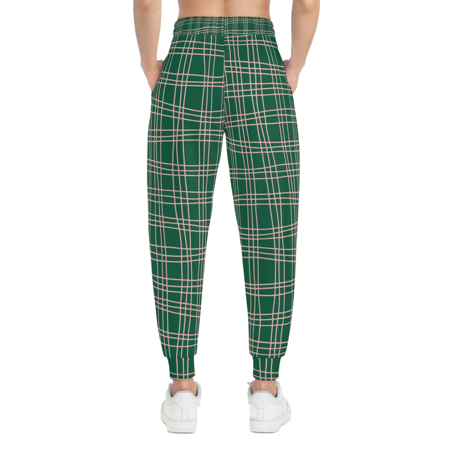 Female model wearing Green Plaid Joggers, back view showing plaid print and fitted ankle cuffs.