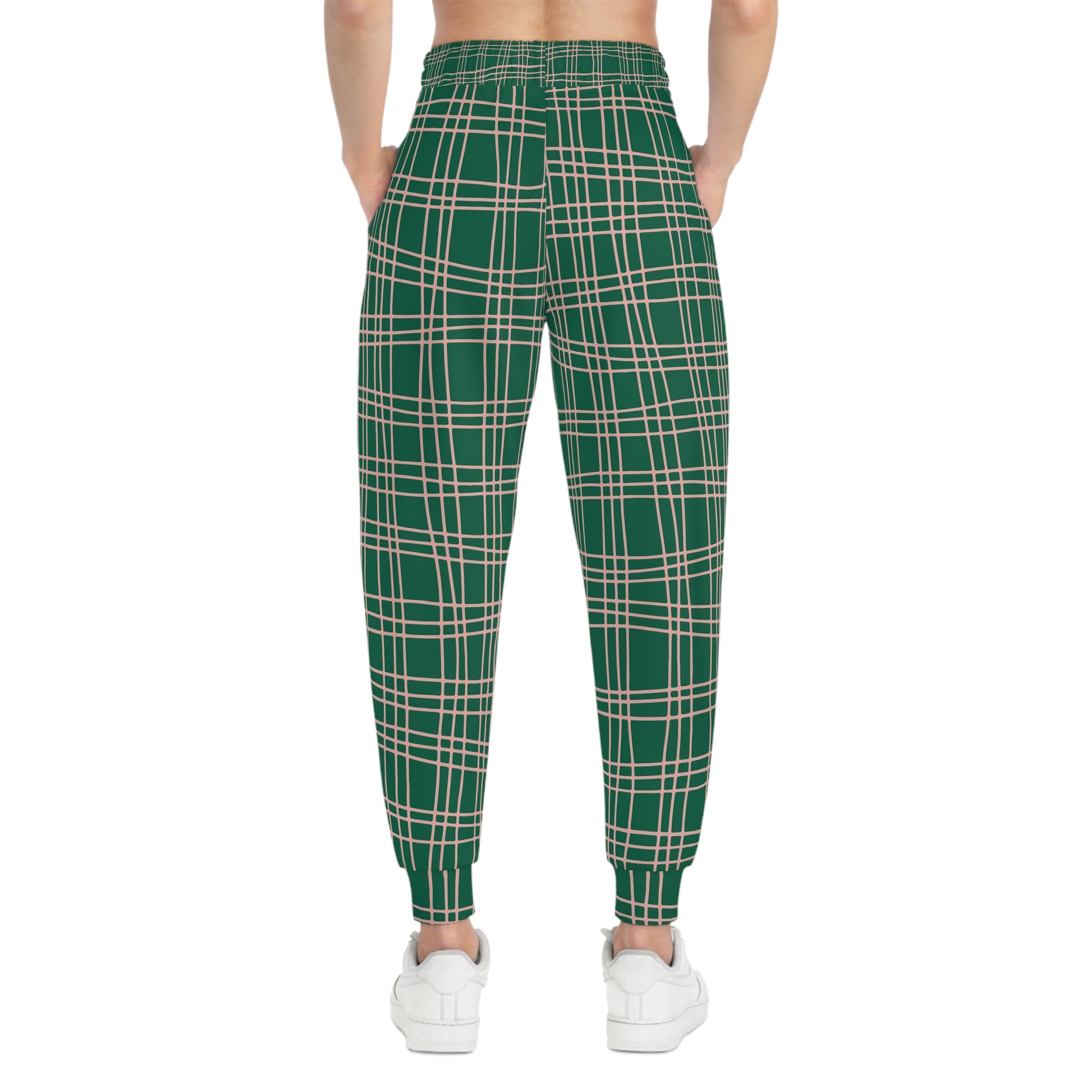 Female model wearing Green Plaid Joggers, back view showing plaid print and fitted ankle cuffs.