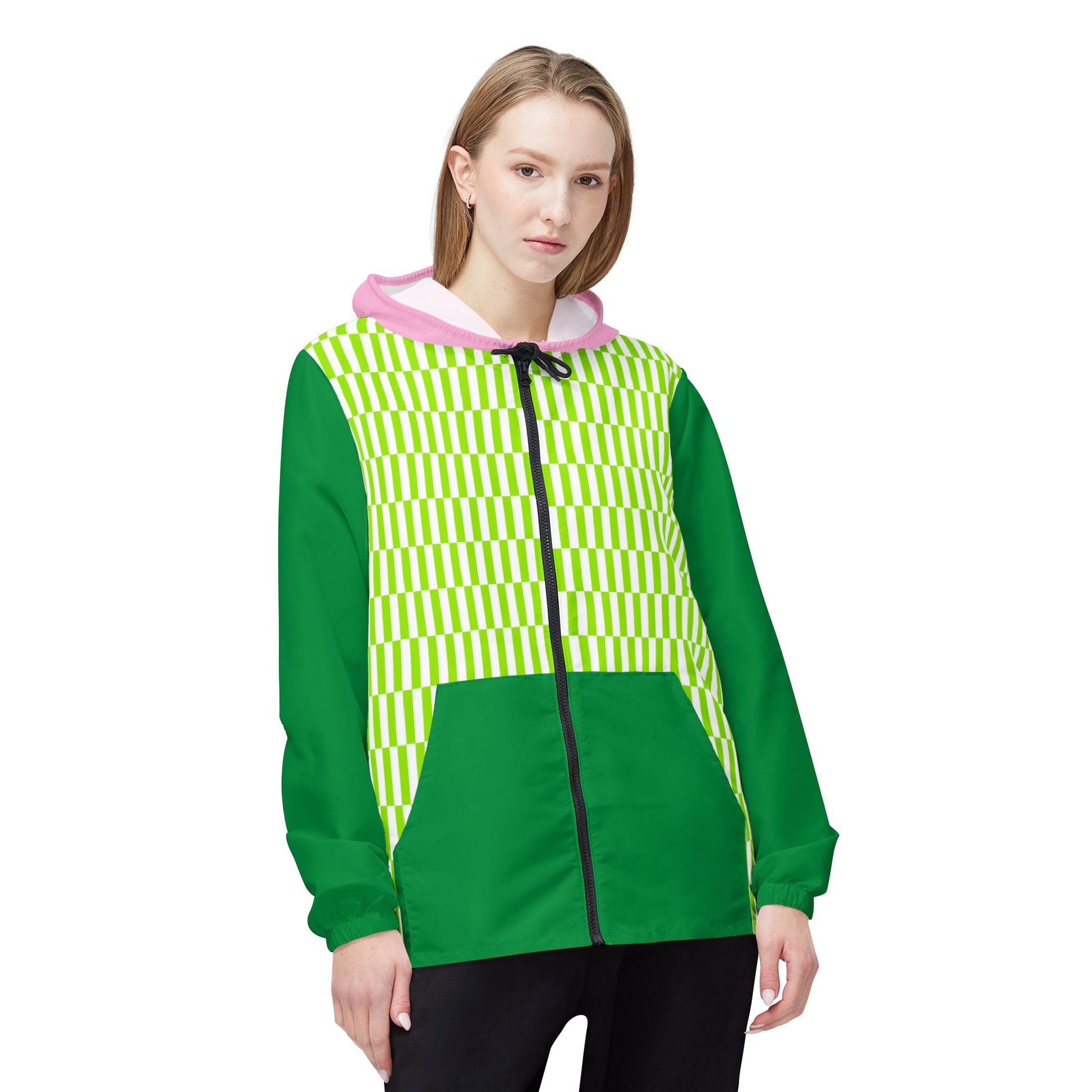 Woman wearing Fresh Vibes Windbreaker front view highlighting green geometric pattern, pink hood, and dark green lower half.