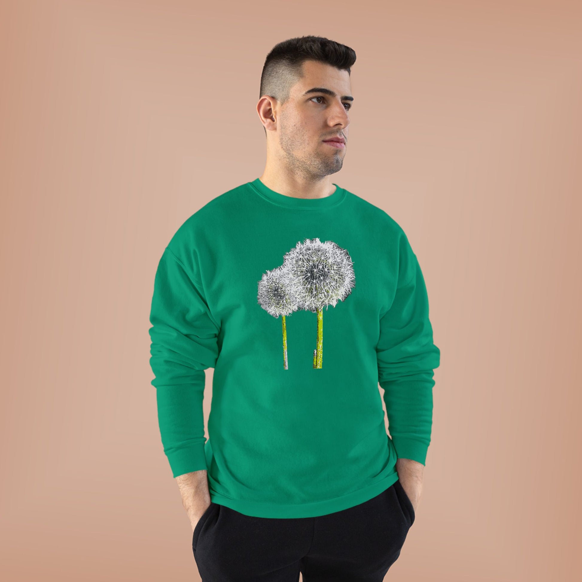 Man in green Tantrum Media Dandelion Unisex Sweatshirt with white dandelion print, peach background