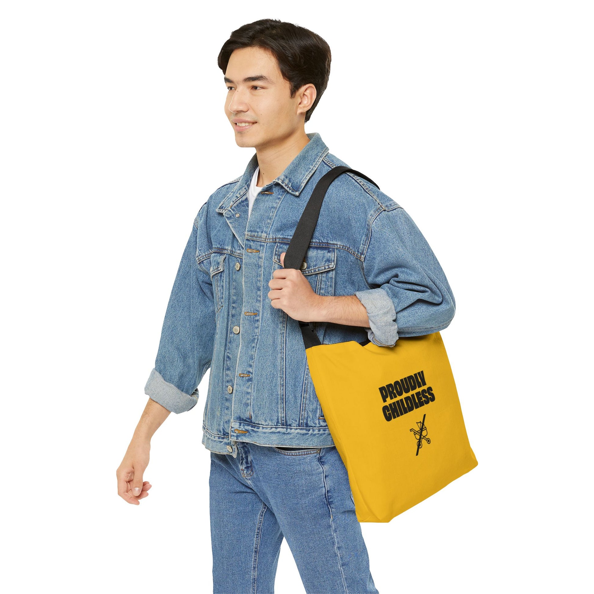 Man in denim jacket carrying Proudly Childless Adjustable Tote Bag in yellow with bold black design