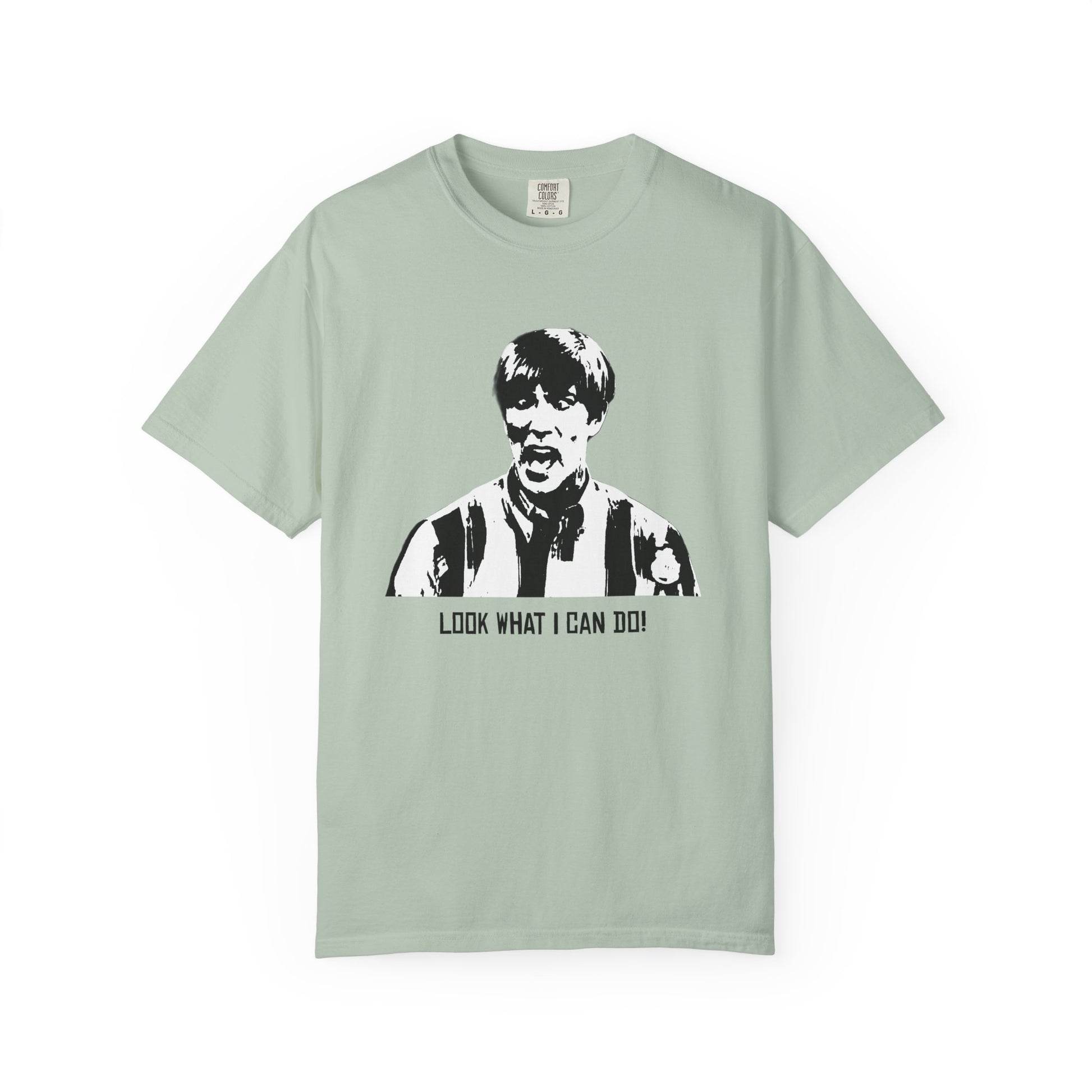 Light sage green Stuart MadTV T-shirt laid flat with character print.