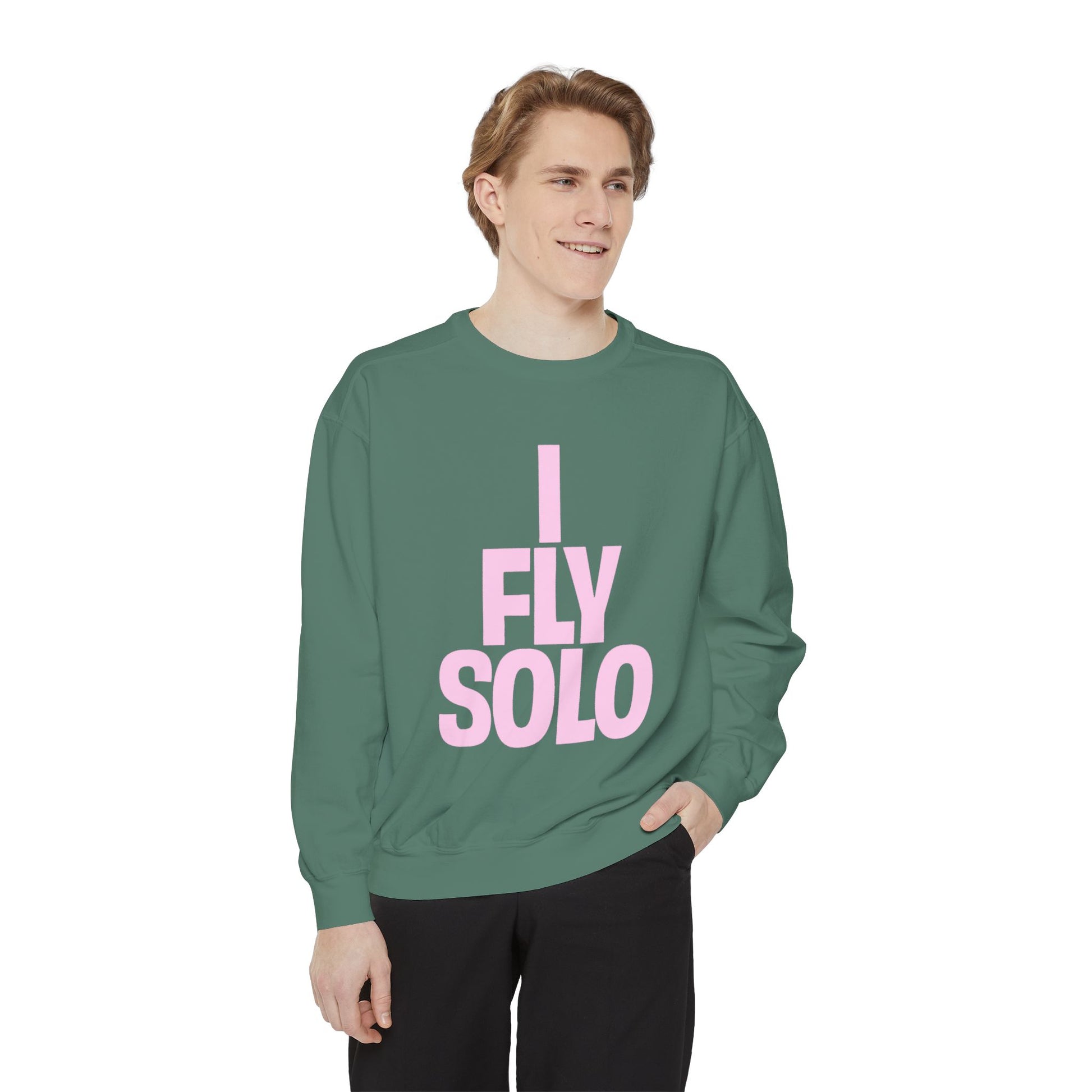Person wearing a green sweatshirt with 'I Fly Solo' text on a white background