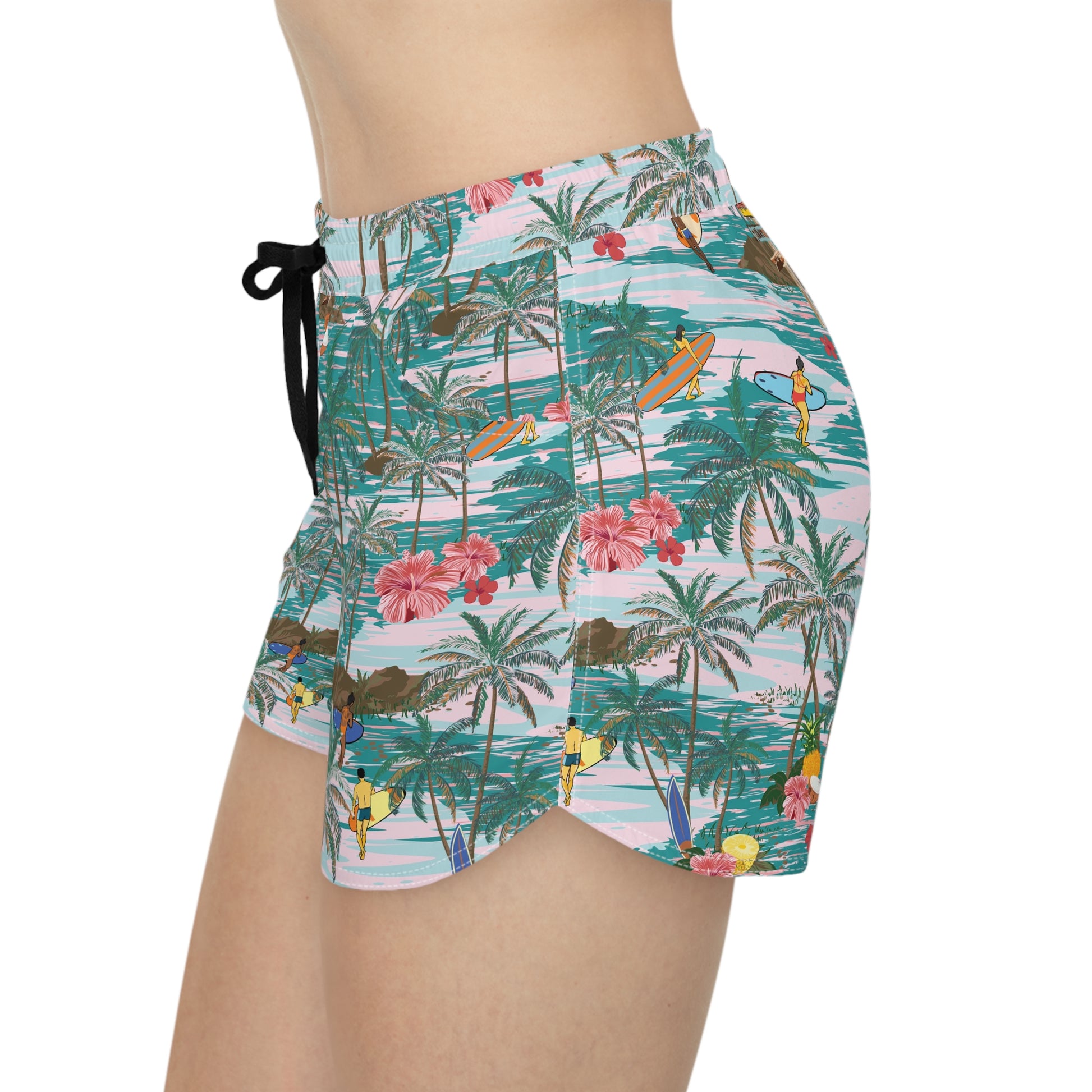 Angled view of women’s Hawaiian shorts showing tropical design and pockets