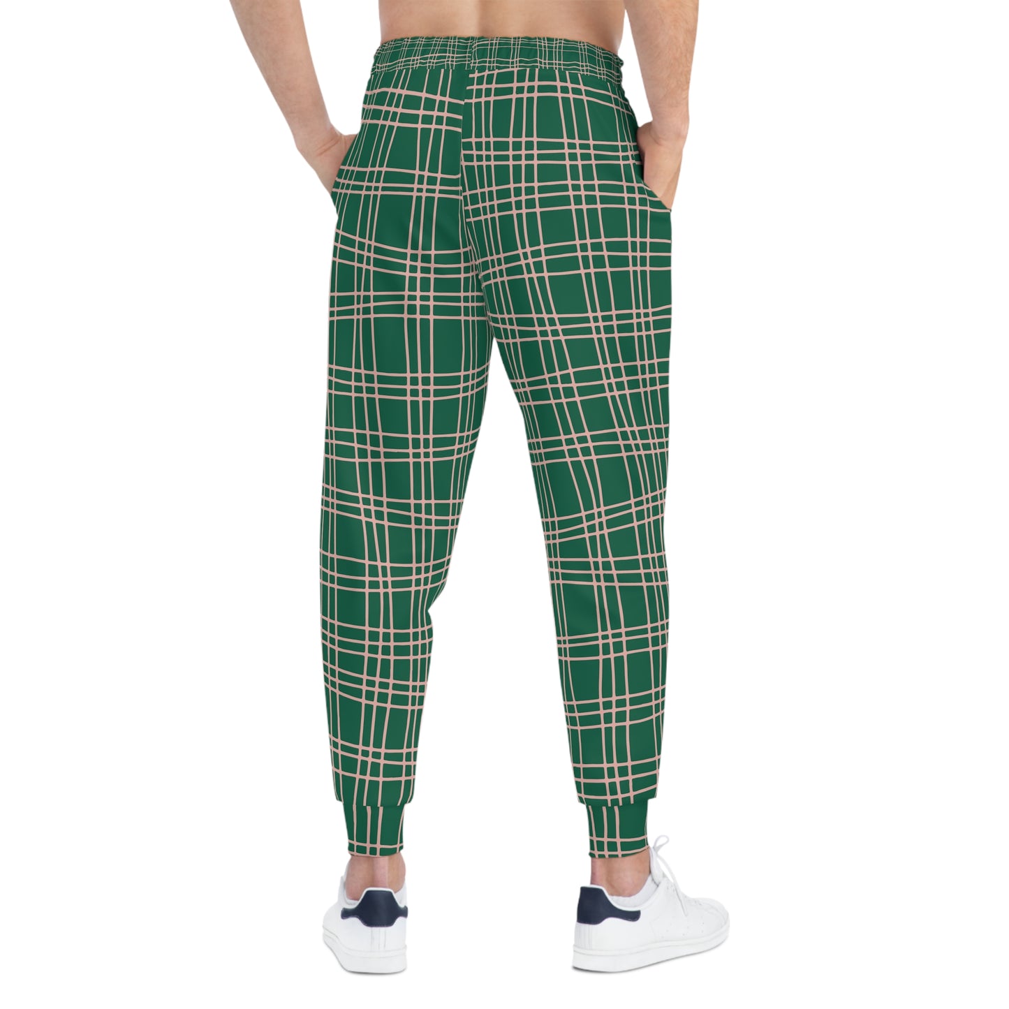 Male model showing the back of Green Plaid Joggers with plaid print and cuffed ankles.
