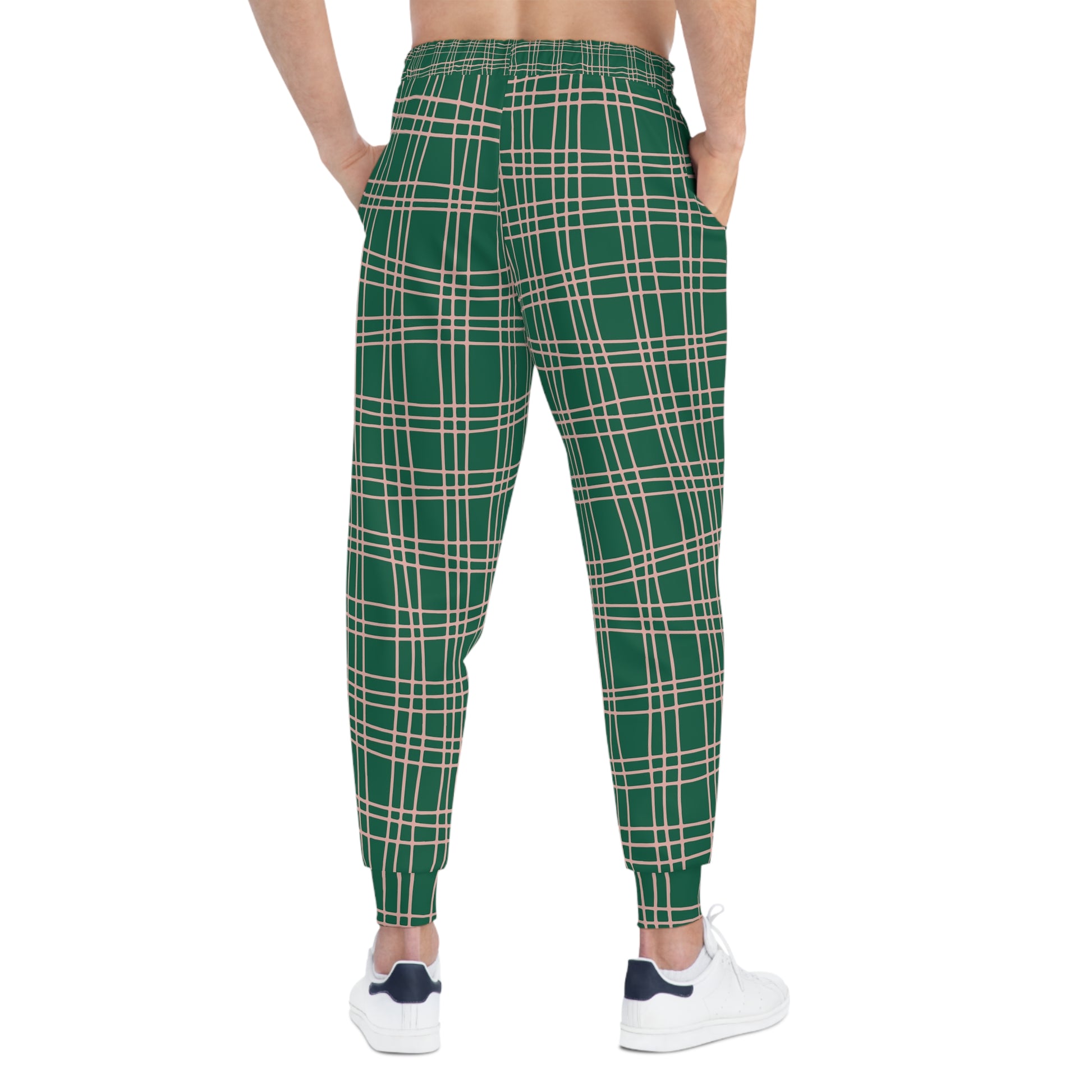 Male model showing the back of Green Plaid Joggers with plaid print and cuffed ankles.