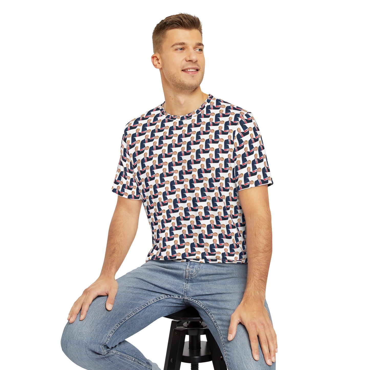 Man sitting on stool wearing The Donald all-over print men’s T-shirt paired with jeans