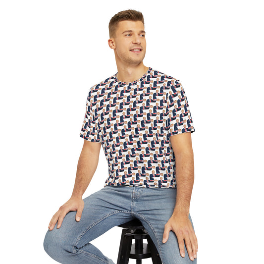 Man sitting on stool wearing The Donald all-over print men’s T-shirt paired with jeans