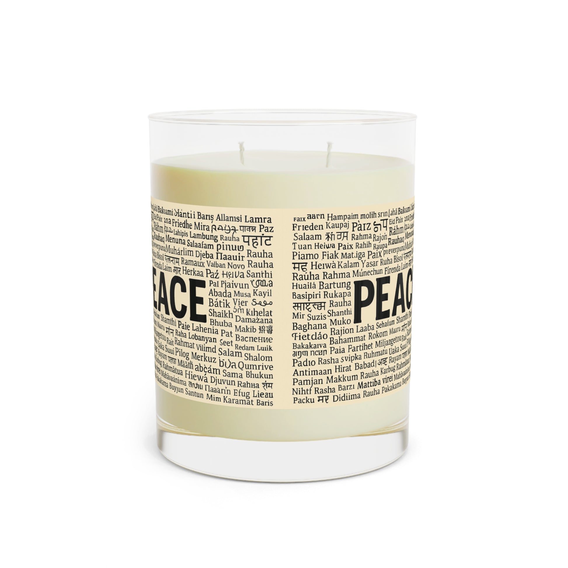 Candle with a label featuring the word 'PEACE' on a white background
